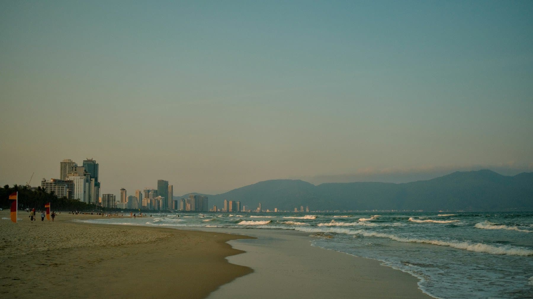 My Khe Beach at water level, high-rises to the left and Sơn Trà ahead
